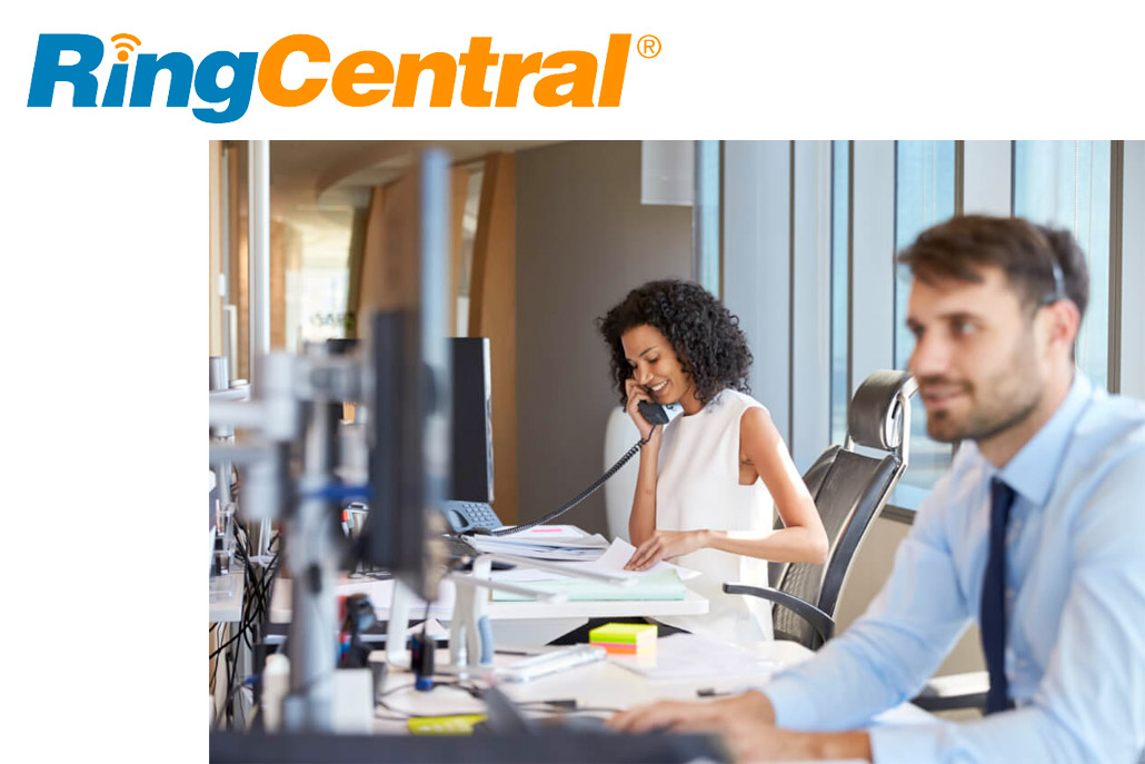 man-and-woman-in-office-environment-working-at-desks man-and-woman-in-office-environment-working-at-desks